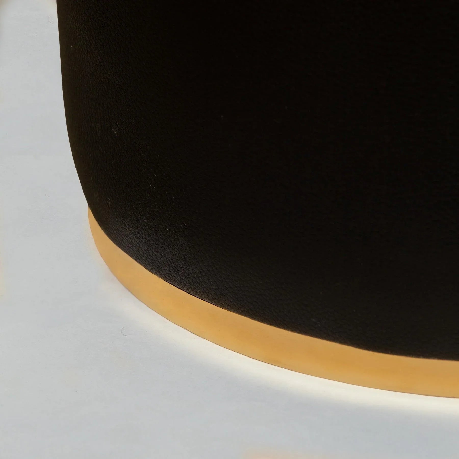 Chic Black Leather Pouf Ottoman with Bronze base in Dubai